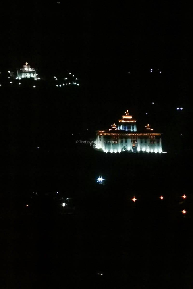 Paro Dzong from my hotel room window. Background is the national museum | All Your First-World Questions about a Bhutan Trip, Answered! • The Petite Wanderess
